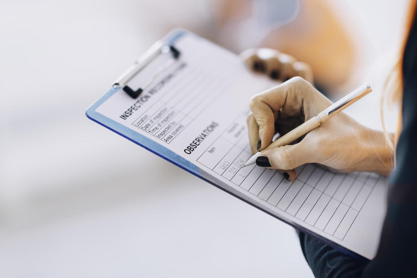 Facility management technician filling inspection form